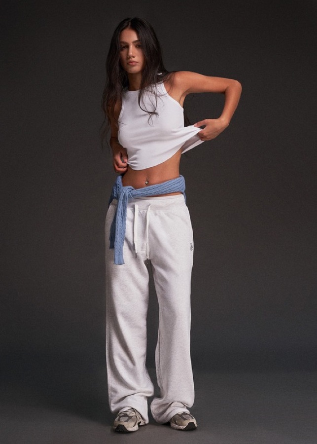 White tank top with grey sweatpants and denim jacket