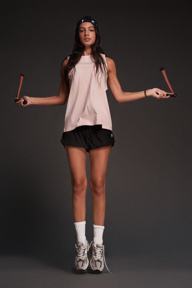 Woman skipping rope in an athleisure outfit